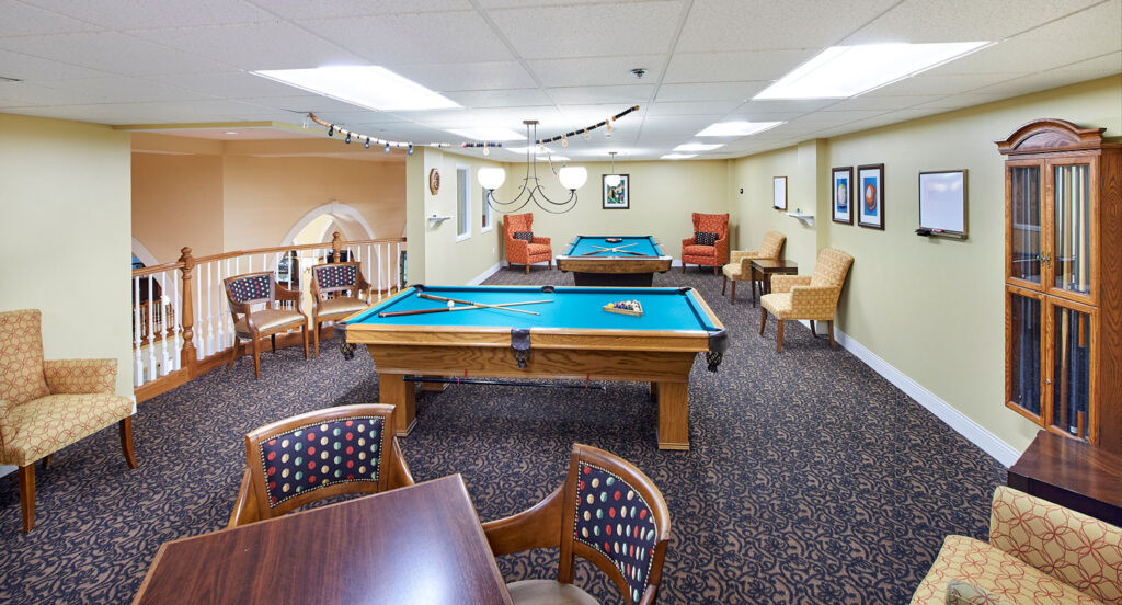 The Billiard Room with pool tables and comfortable chairs