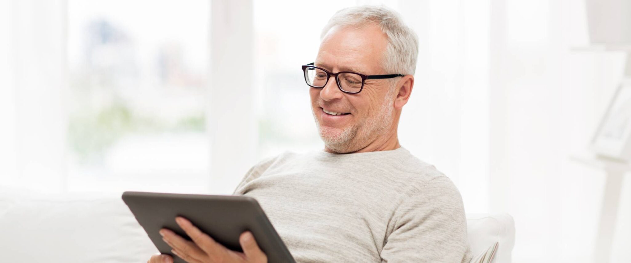 man looking at a tablet