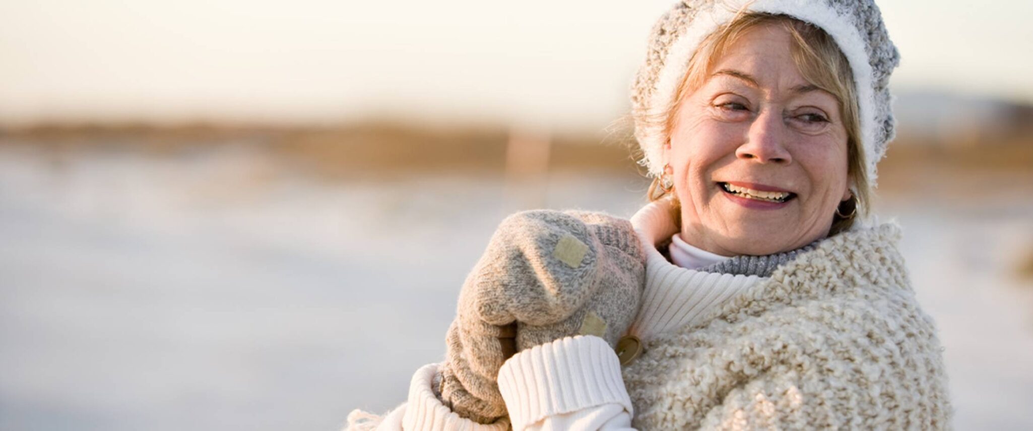 happy cold senior outside on a cold winter day