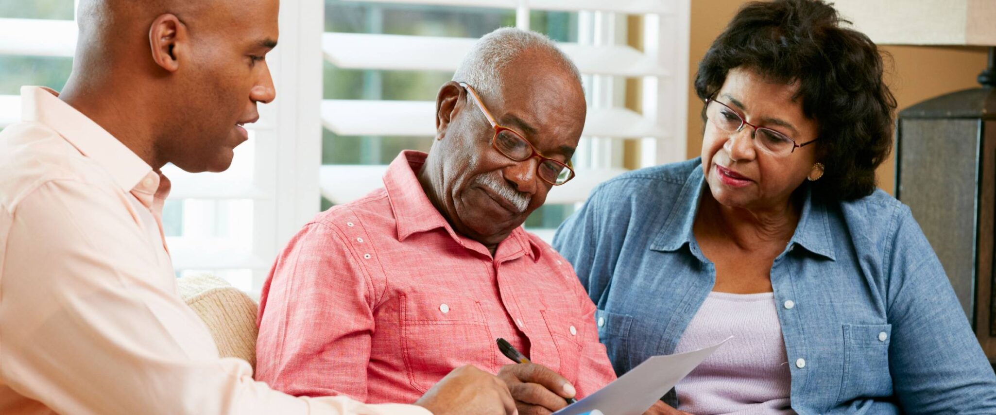 man and woman talking with a senior living expert