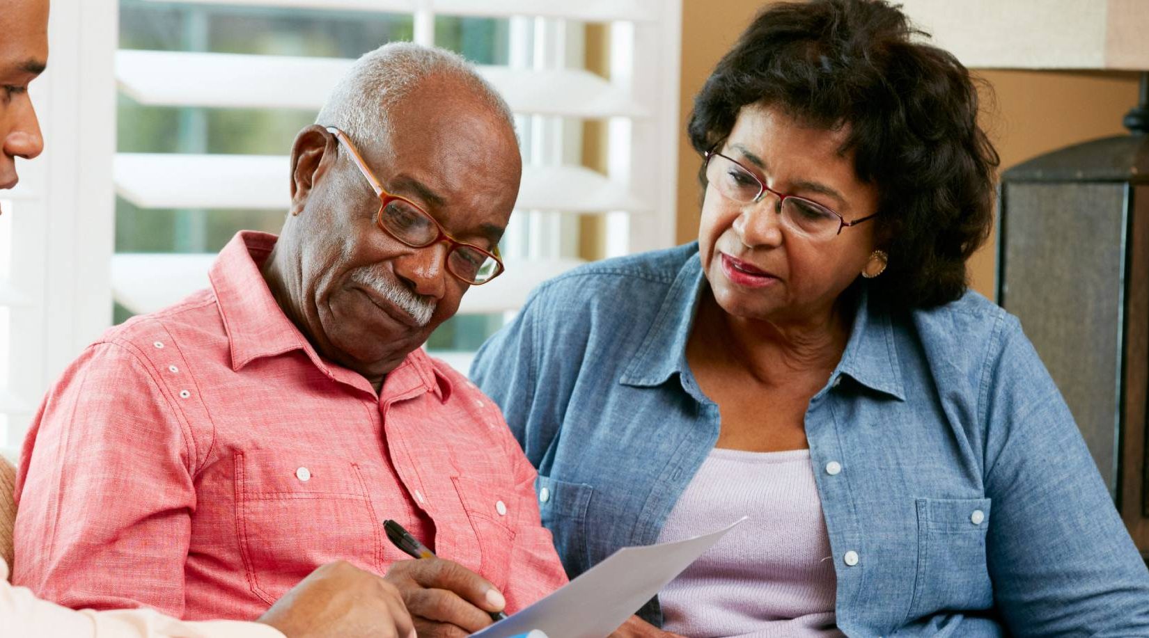 man and woman talking with a senior living expert