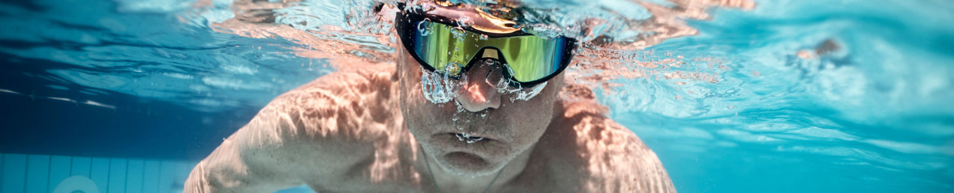 man underwater with goggles