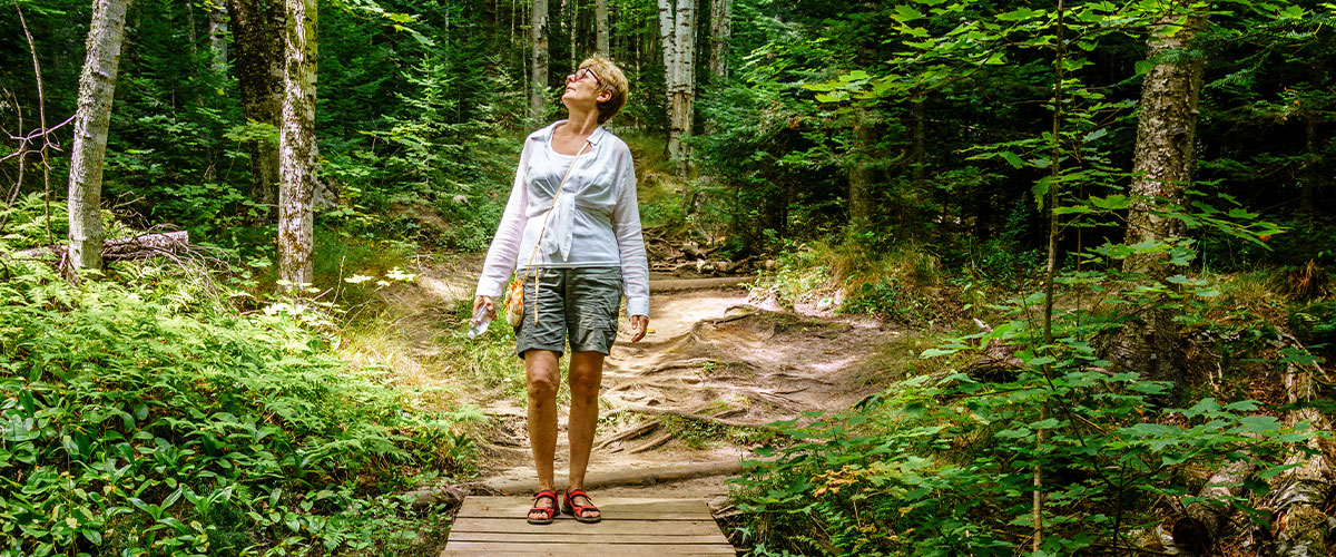 Senior woman enjoying a hiking trail
