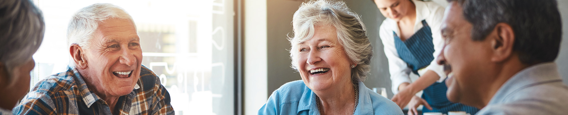 seniors laughing at a retirement community