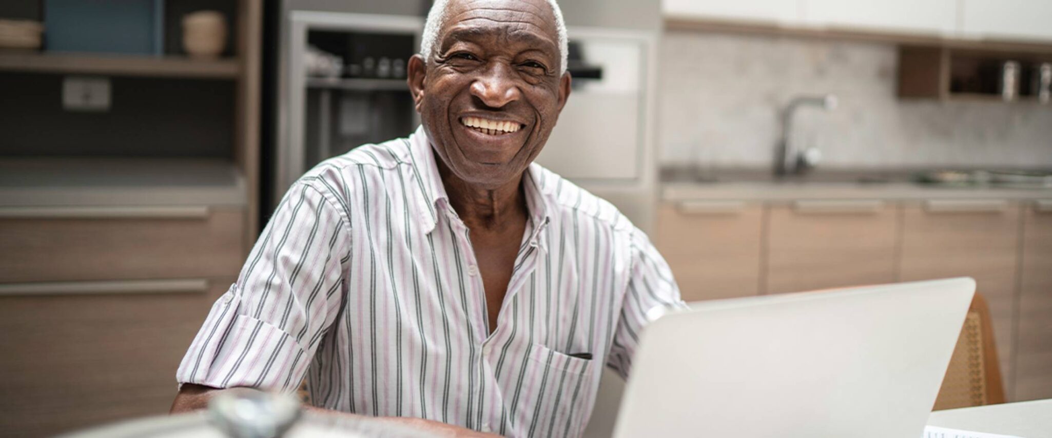 senior man looking at a laptop