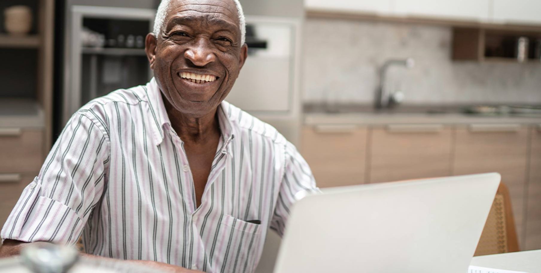 senior man looking at a laptop