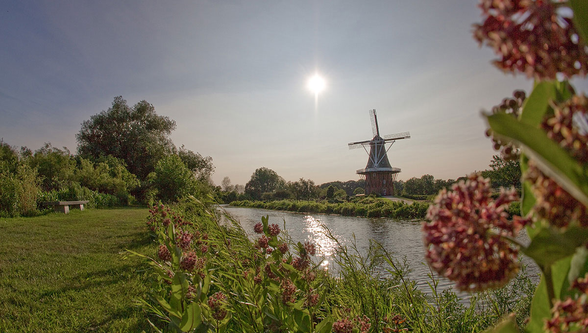 windmill and lake outside of freedom village holland