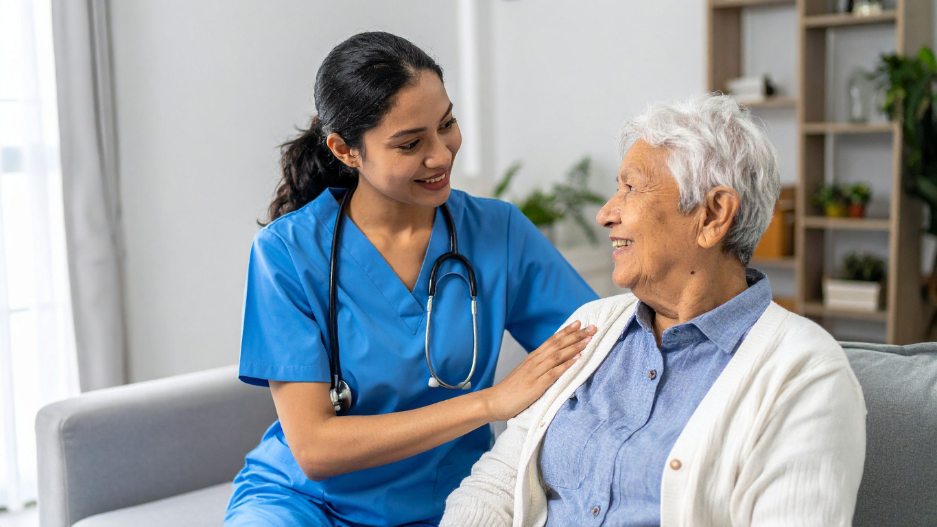 Healthcare worker smiling at senior woman