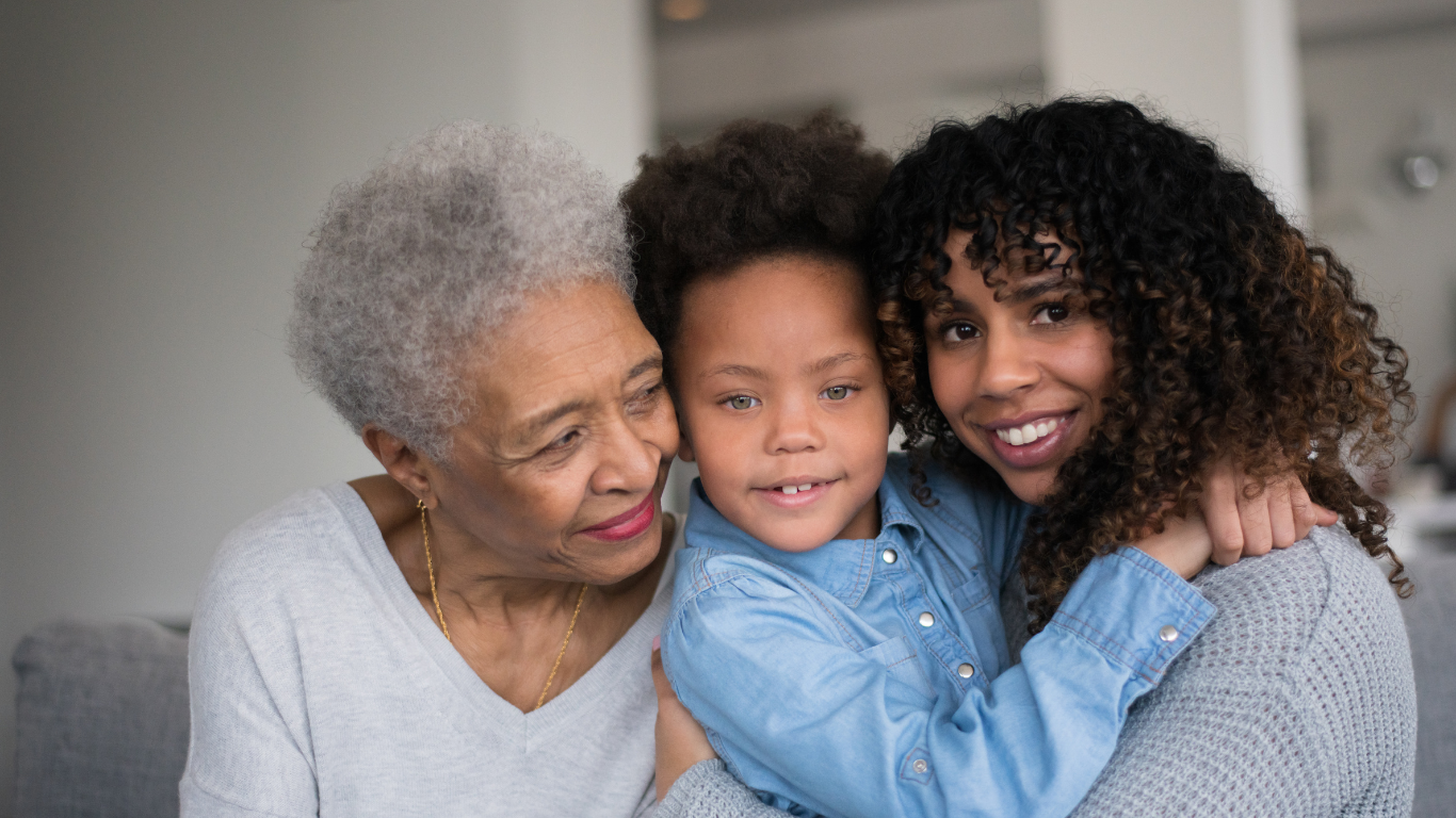 Blog Images (20) A grandmother, daughter, and granddaughter pose for a photo together