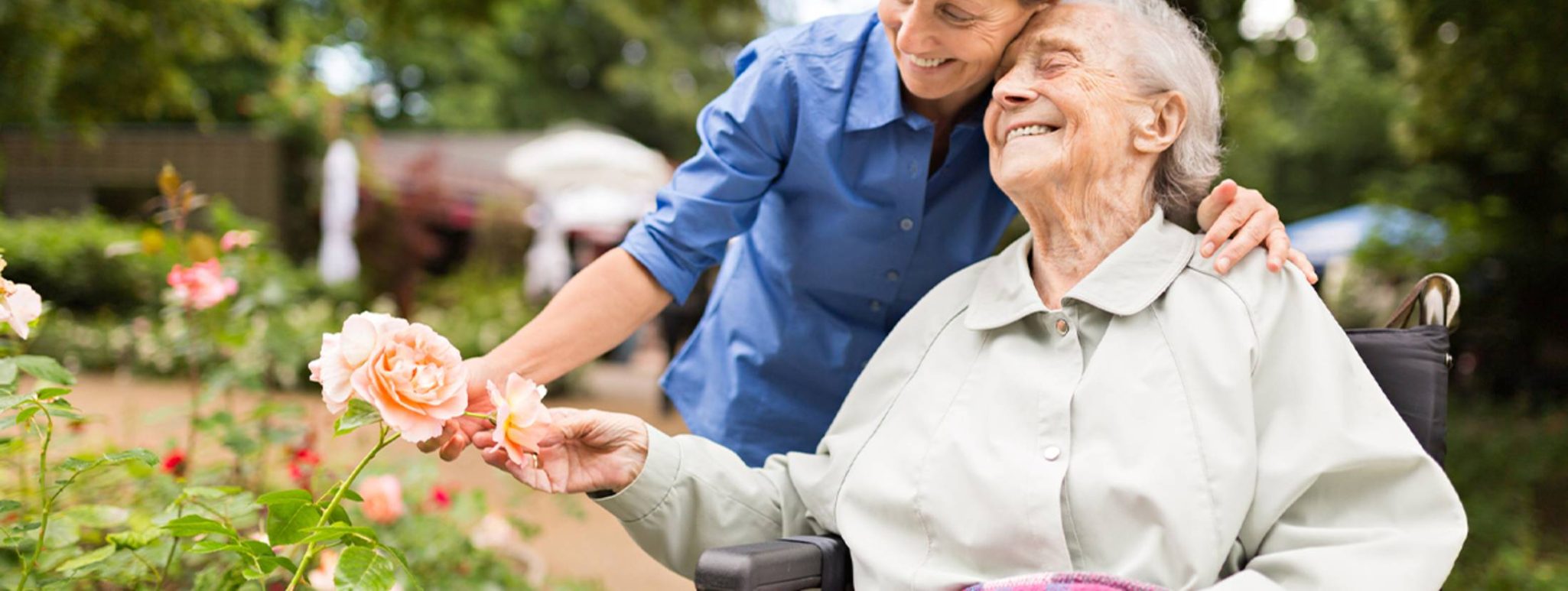 FVHOLL_August_Blog_2a Senior woman holding flowers on a walk in her retirement community