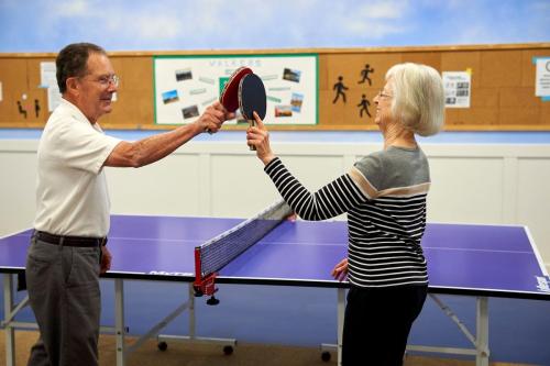 older adults playing table tennis