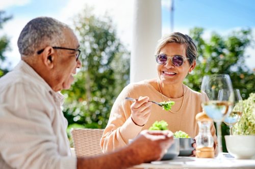 Shot of a senior couple having lunch together outside